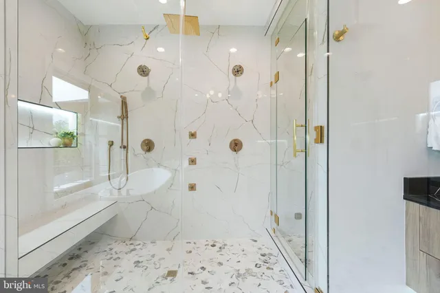 a bathroom with a bathtub and a shower