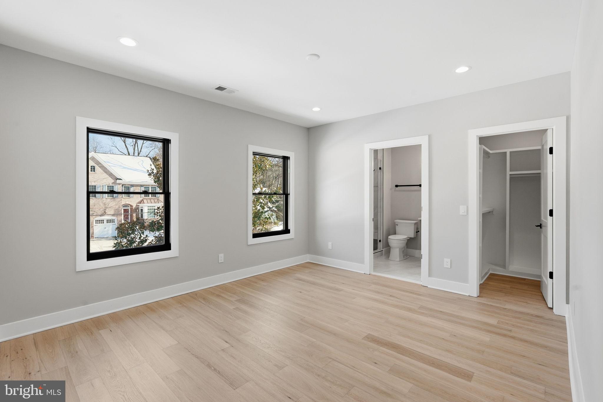 2202 Grayson Place Falls Church, VA 22043 - Photo 42 of 77 a view of empty room with wooden floor and window
