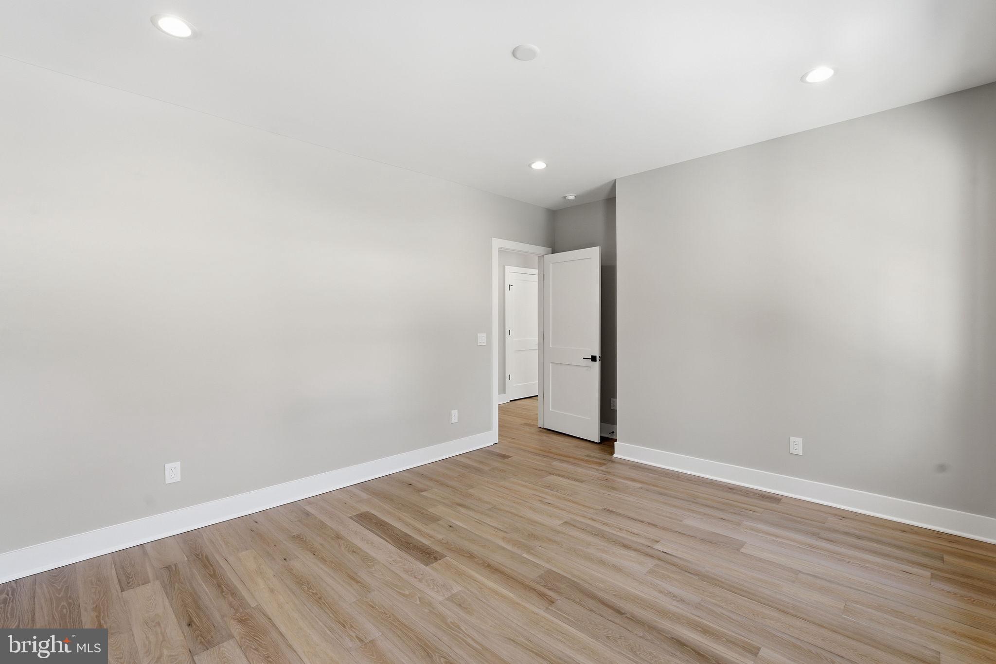2202 Grayson Place Falls Church, VA 22043 - Photo 44 of 77 a view of an empty room with wooden floor