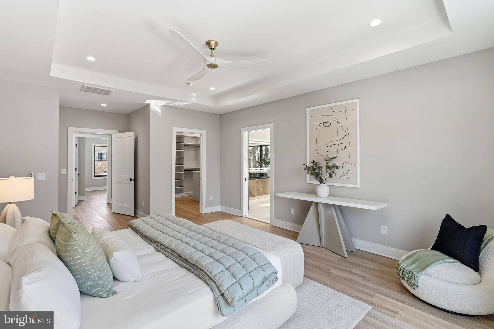 2202 Grayson Place Falls Church, VA 22043 - Photo 47 of 77 a spacious bedroom with a bed and a table chair