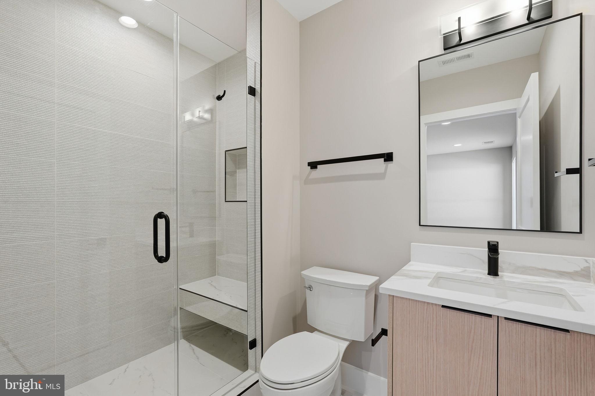 2202 Grayson Place Falls Church, VA 22043 - Photo 53 of 77 a bathroom with a granite countertop sink toilet and shower