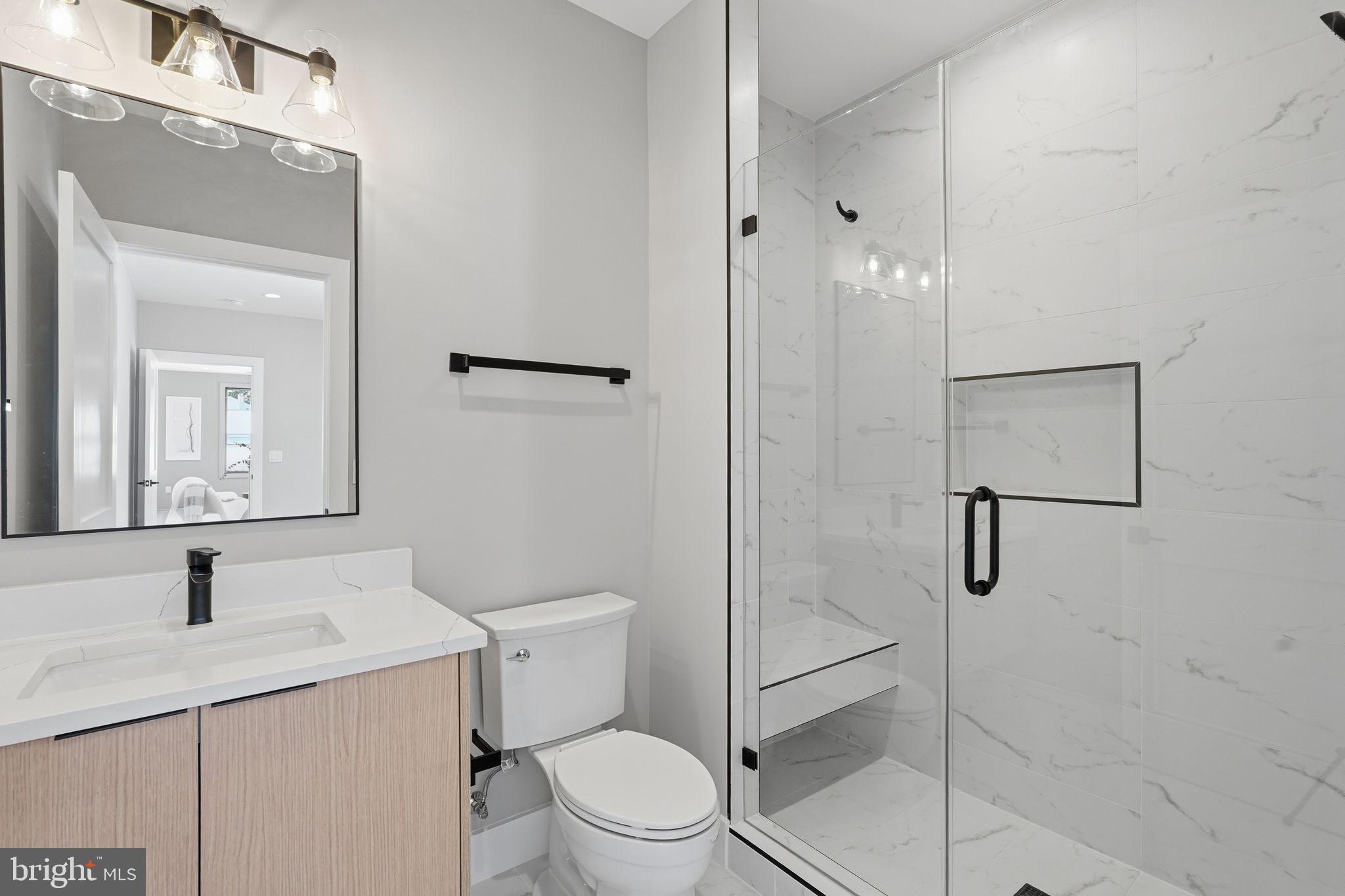 2202 Grayson Place Falls Church, VA 22043 - Photo 55 of 77 a bathroom with a granite countertop sink toilet and shower