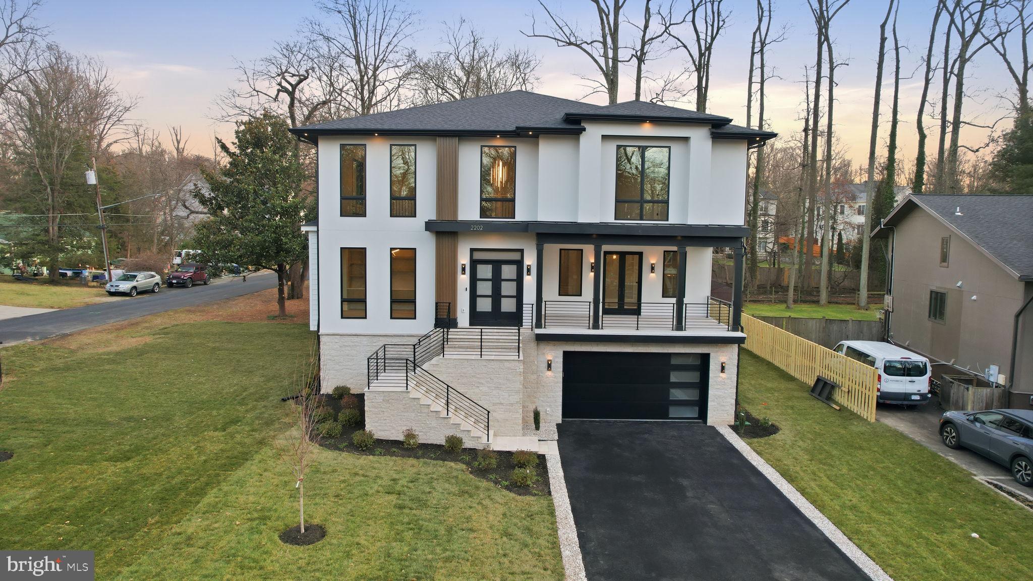2202 Grayson Place Falls Church, VA 22043 - Photo 6 of 77 a front view of a house with garden