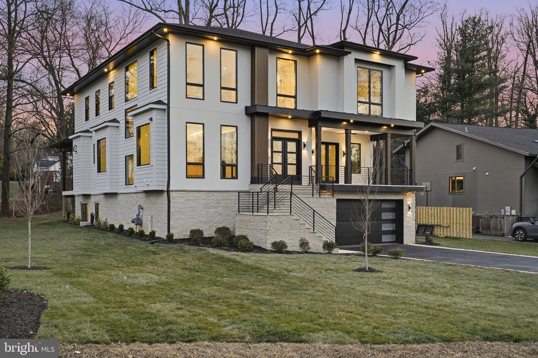 2202 Grayson Place Falls Church, VA 22043 - Photo 8 of 77 a view of a white house with large windows