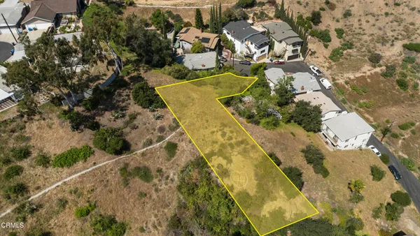 an aerial view of residential house with swimming pool