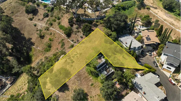 an aerial view of residential house with swimming pool