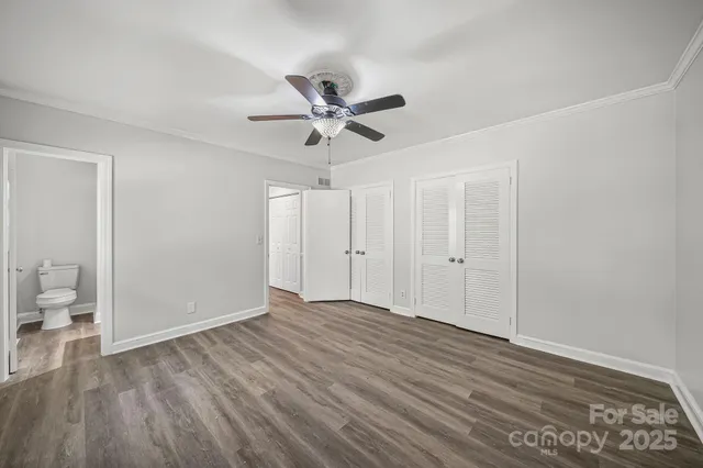 a view of an empty room and wooden floor