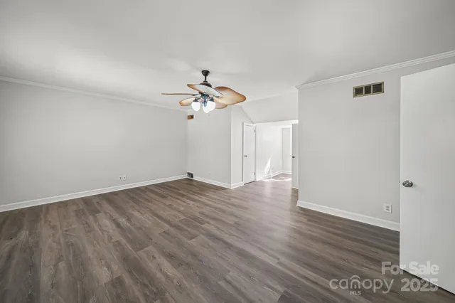 a view of a livingroom with wooden floor