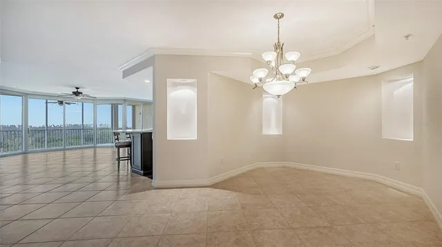 a view of a balcony with a floor to ceiling window and wooden fence