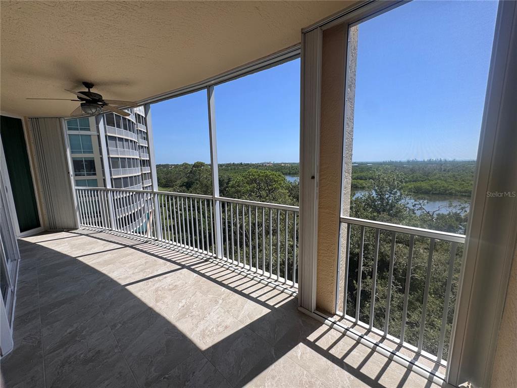 401 North Point Road, Unit 603 Osprey, FL 34229 - Photo 22 of 96 a view of a balcony with wooden floor