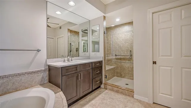 a living room with furniture and a floor to ceiling windows