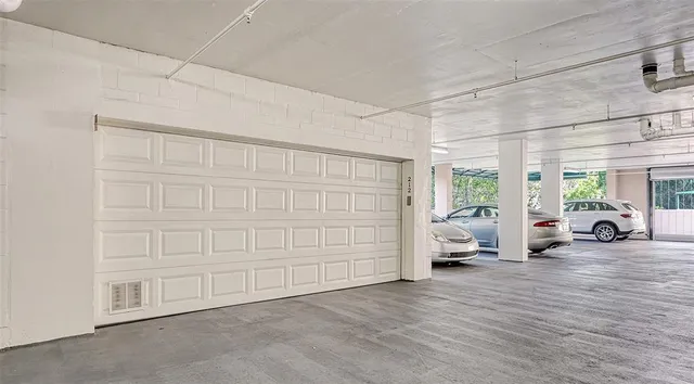 an aerial view of a house with outdoor space and lake view