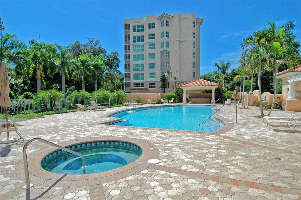 401 North Point Road, Unit 603 Osprey, FL 34229 - Photo 49 of 96 a view of a swimming pool with a patio