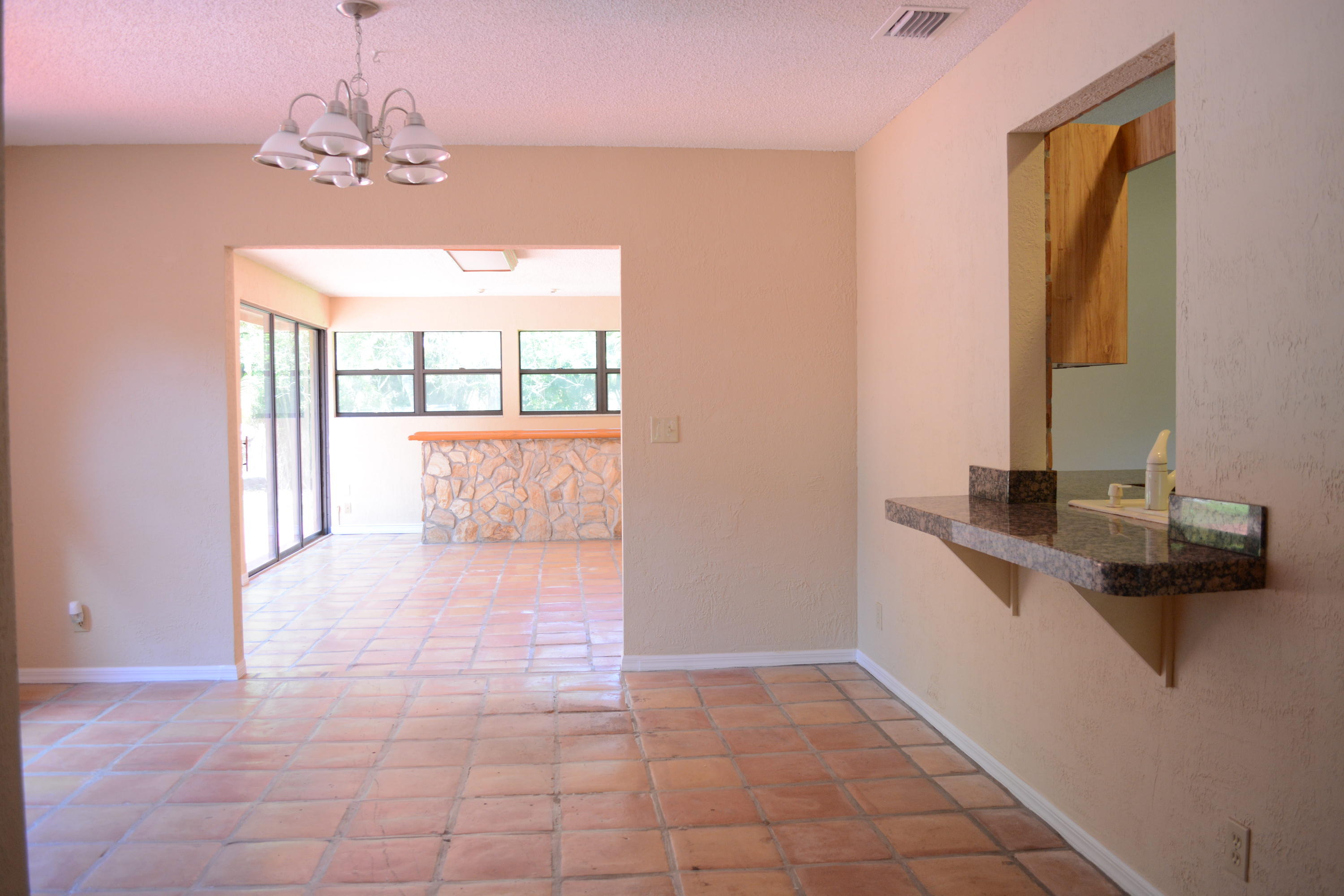 12358 154th Road North Jupiter, FL 33478 - Photo 10 of 18 Formal Dining leading into Florida Room