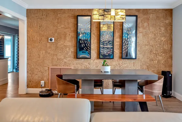 a view of a dining room with furniture and window