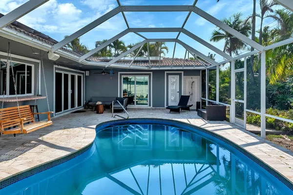 a view of a swimming pool with a patio