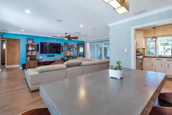 a kitchen with granite countertop white cabinets and white stainless steel appliances