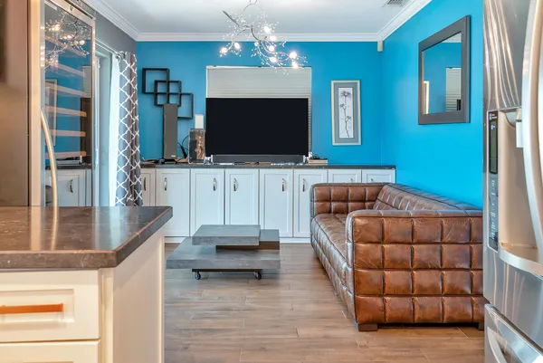 a living room with furniture and a flat screen tv