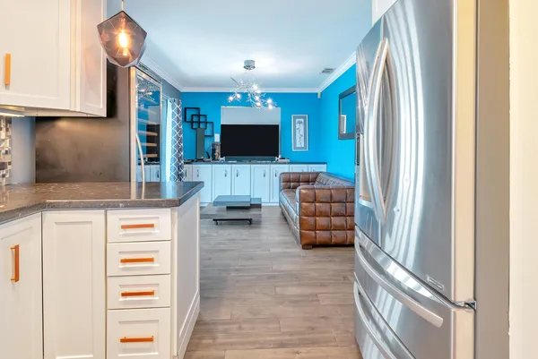 a bedroom with furniture and a wooden floor