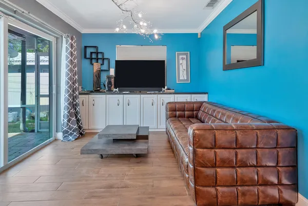 a living room with a couch and a window
