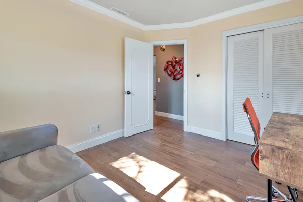 a living room with a couch and cabinets