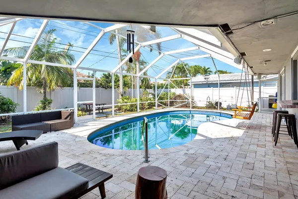 a view of a swimming pool with a patio