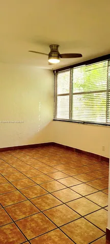 a view of an ocean & mountain view from a big room