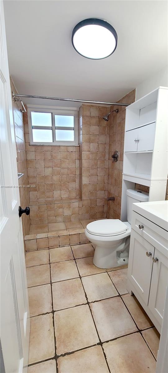 9410 Live Oak Place, Unit 109 Davie, FL 33324 - Photo 14 of 23 a bathroom with a toilet and a shower