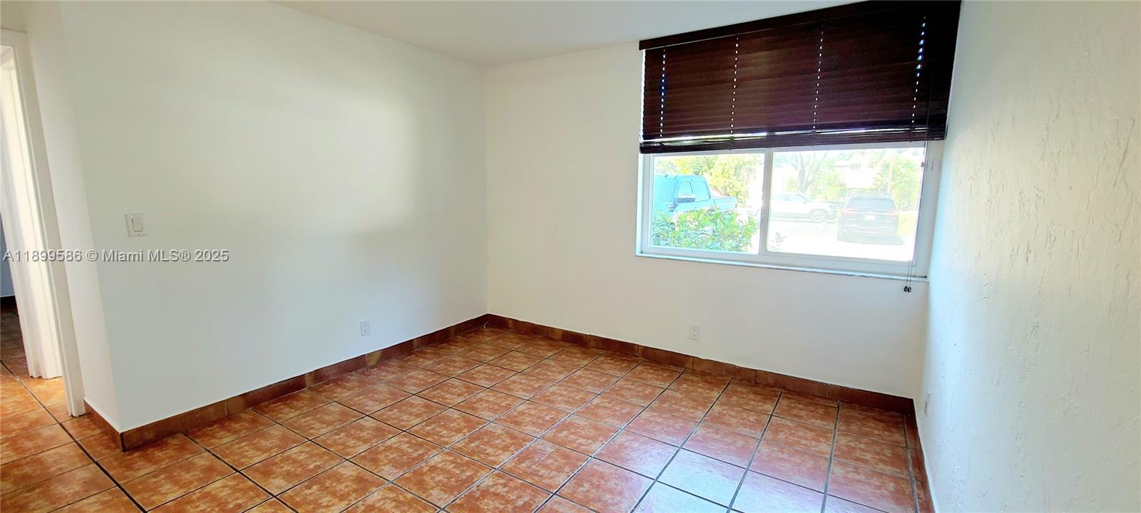 9410 Live Oak Place, Unit 109 Davie, FL 33324 - Photo 15 of 23 a view of an empty room with a window