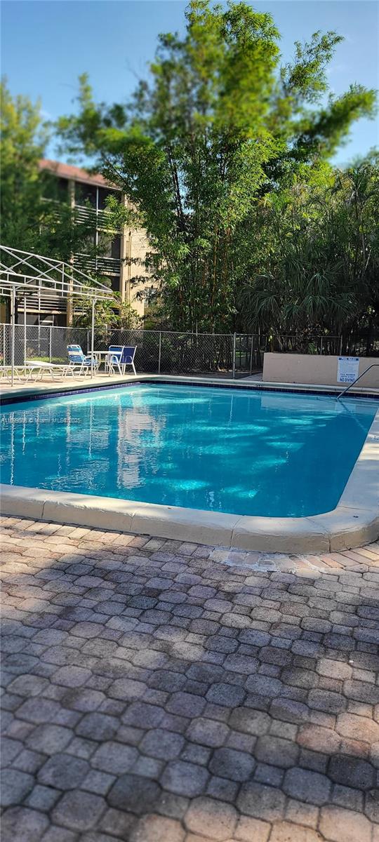 9410 Live Oak Place, Unit 109 Davie, FL 33324 - Photo 22 of 23 a view of a backyard