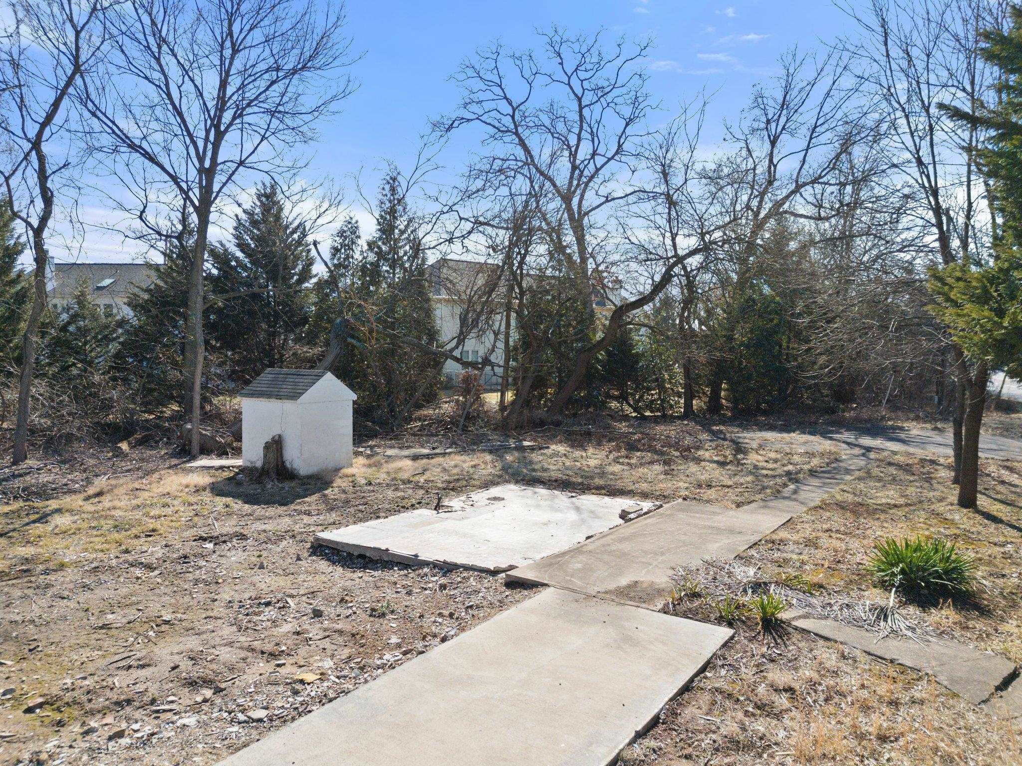 20576 Ashburn Road Ashburn, VA 20147 - Photo 11 of 16 a view of a backyard space with wooden fence