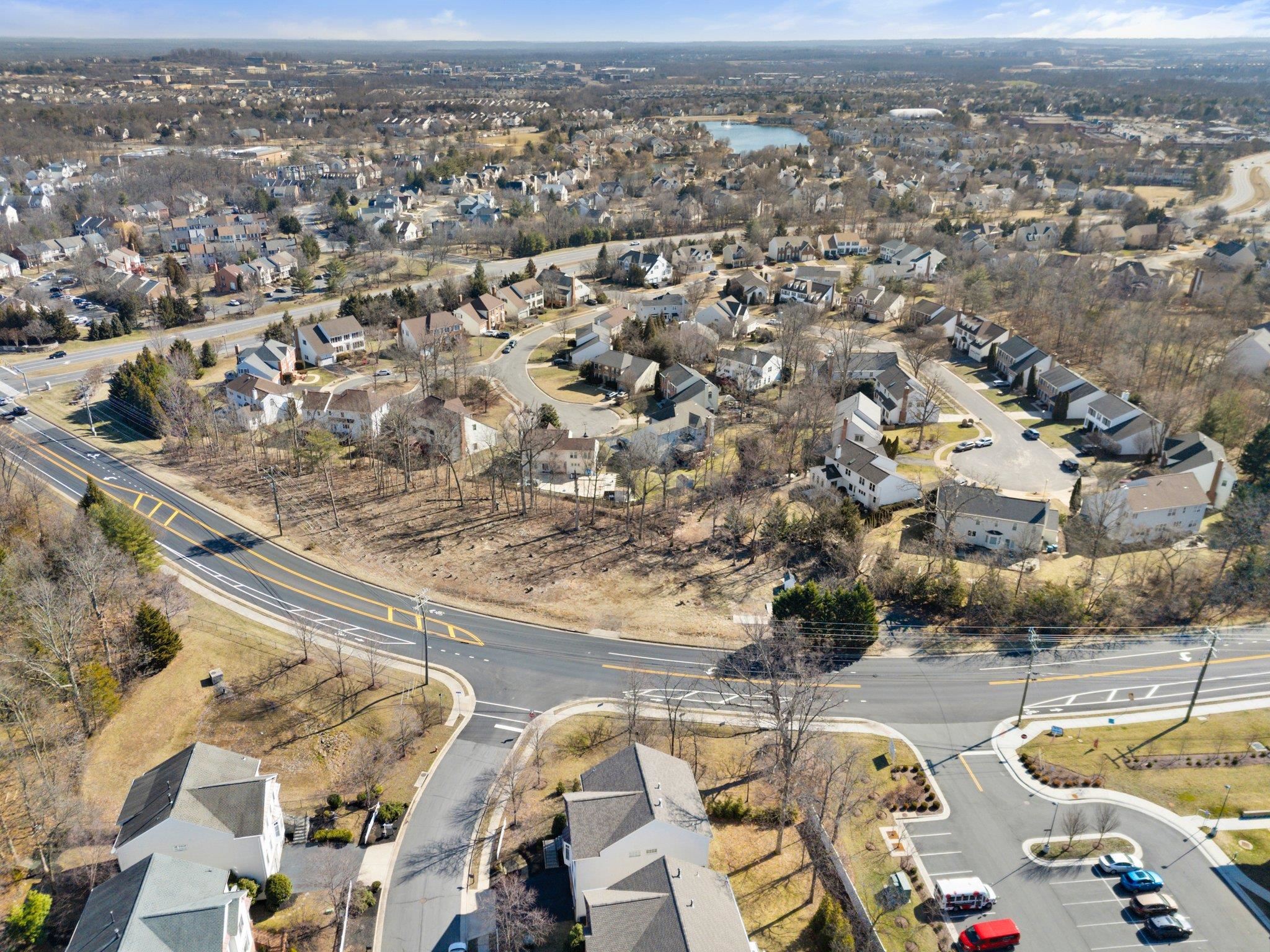 20576 Ashburn Road Ashburn, VA 20147 - Photo 3 of 16 an aerial view of residential houses with outdoor space