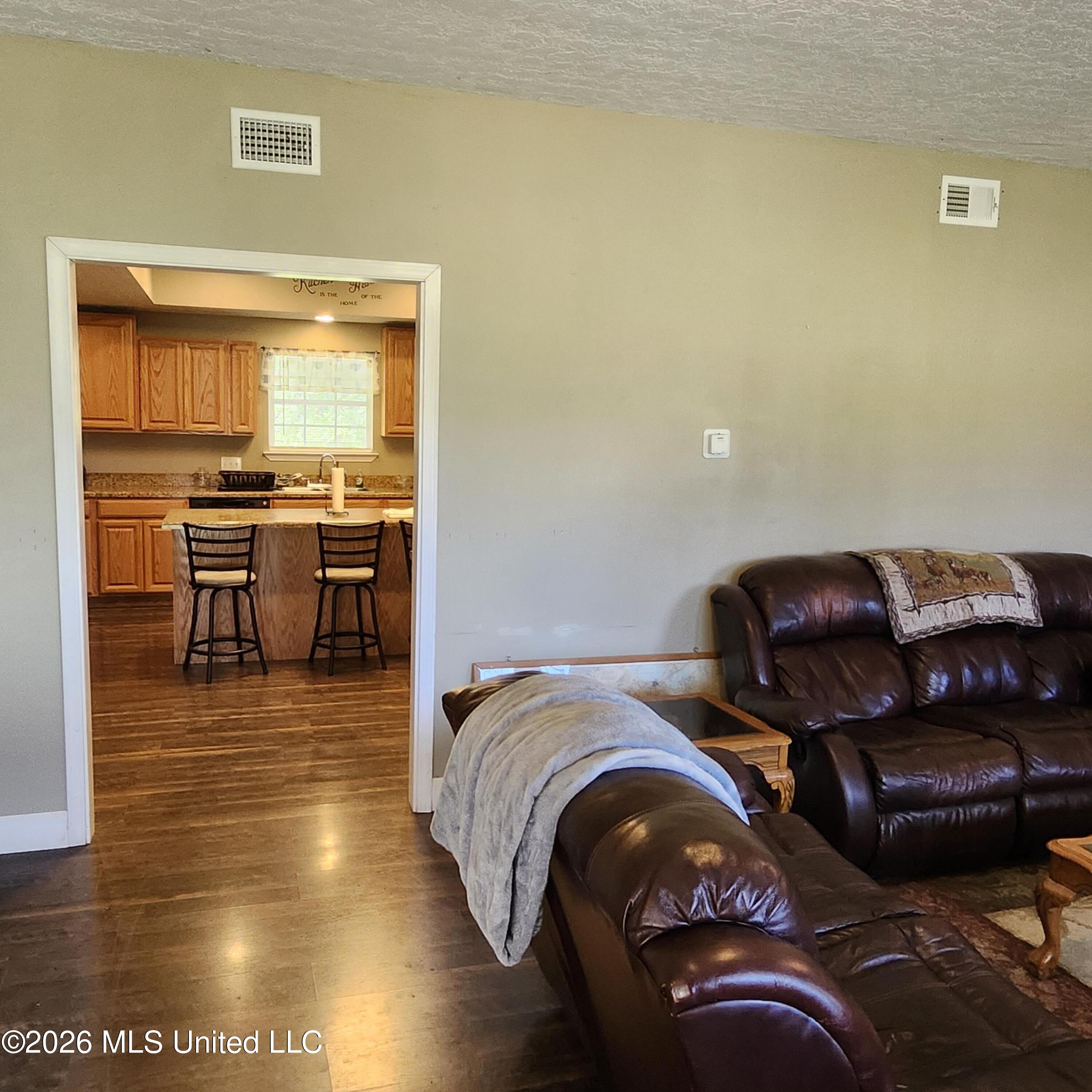 12 Austin Lane Perkinston, MS 39573 - Photo 4 of 60 living room looking into kitchen