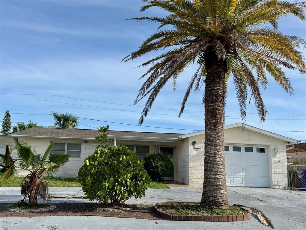 3914 Carioca Road Holiday, FL 34691 - Photo 2 of 23 a front view of a house with garden