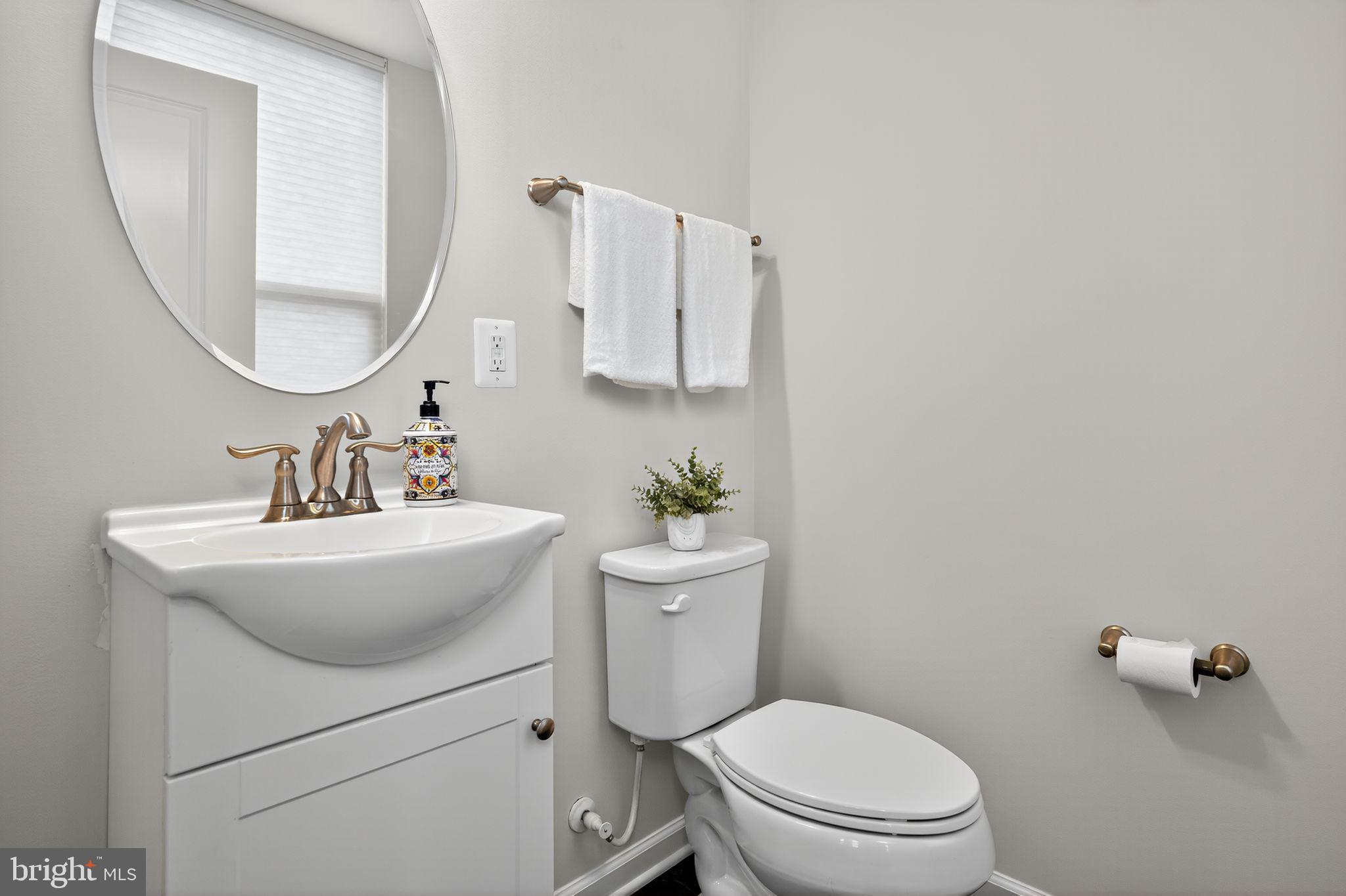 3637 Jamison Street Northeast Washington, DC 20018 - Photo 22 of 44 a bathroom with a sink toilet and a mirror