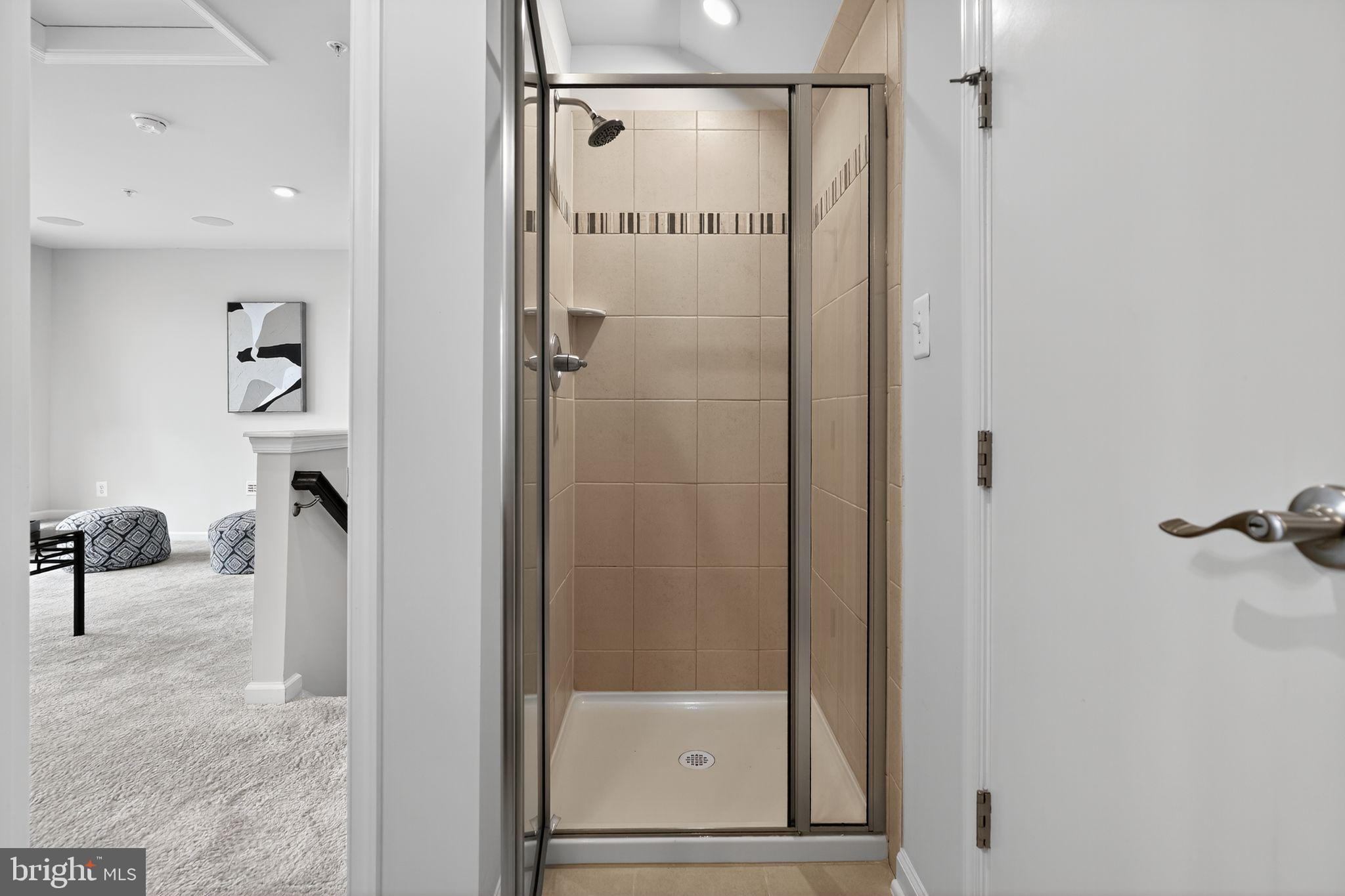 3637 Jamison Street Northeast Washington, DC 20018 - Photo 23 of 44 a bathroom with a glass shower door