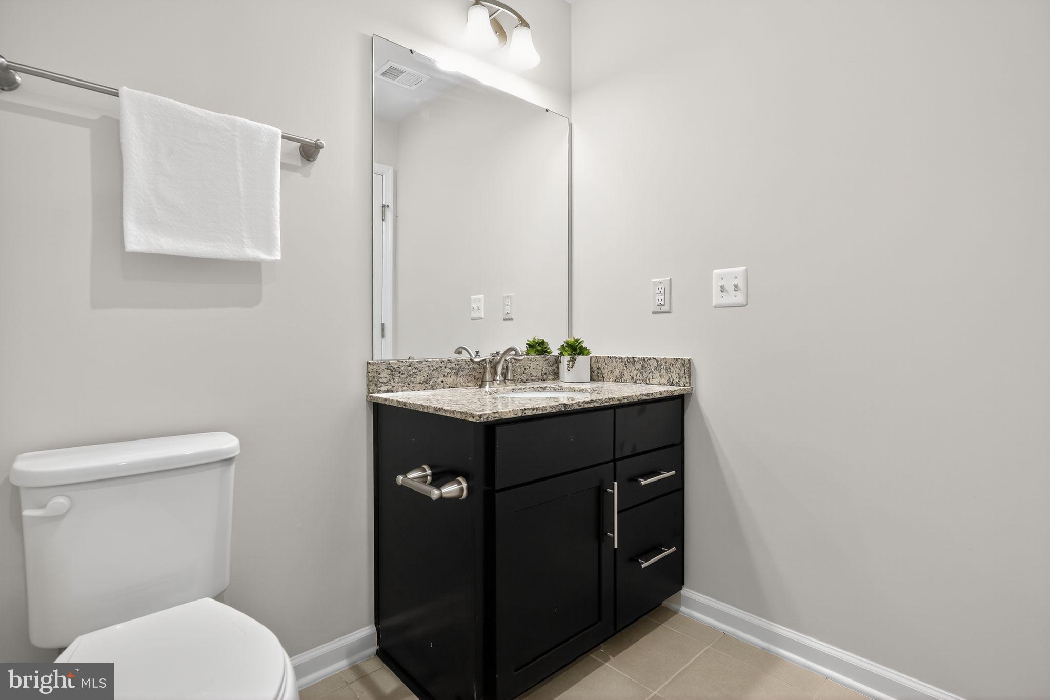 3637 Jamison Street Northeast Washington, DC 20018 - Photo 24 of 44 a bathroom with a sink vanity and a toilet