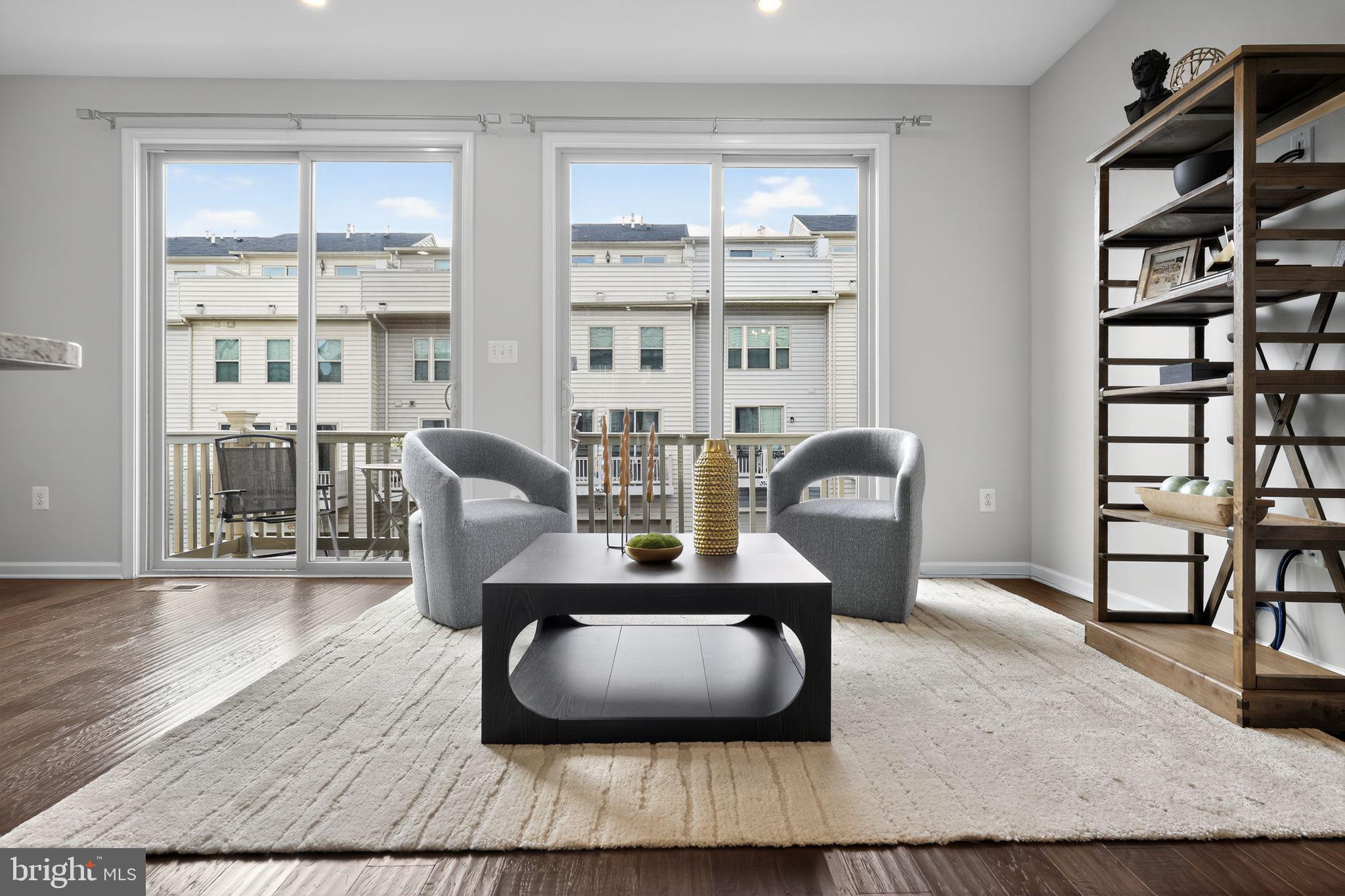 3637 Jamison Street Northeast Washington, DC 20018 - Photo 25 of 44 a living room with furniture floor to ceiling window and wooden floor