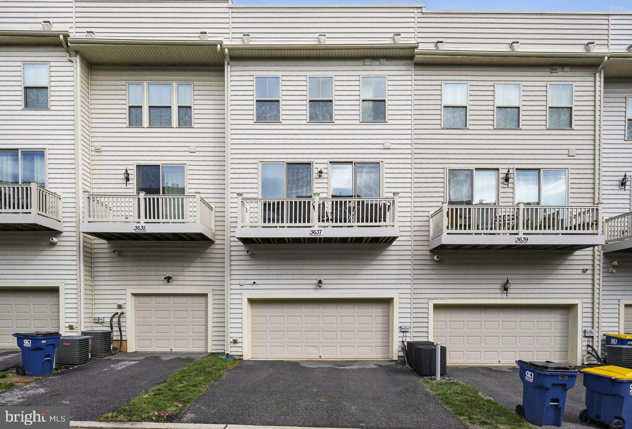 3637 Jamison Street Northeast Washington, DC 20018 - Photo 30 of 44 a view of a house with a small yard and a large window