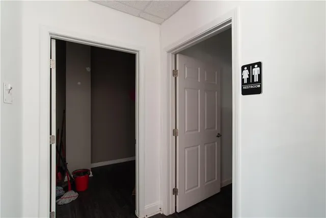 a kitchen with a sink cabinets and chandelier