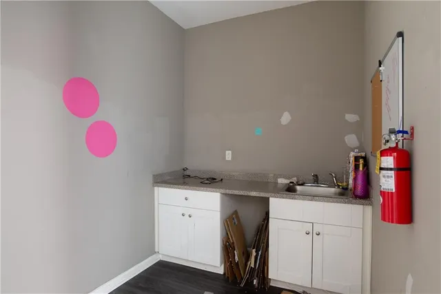 a bathroom with a sink toilet and a mirror
