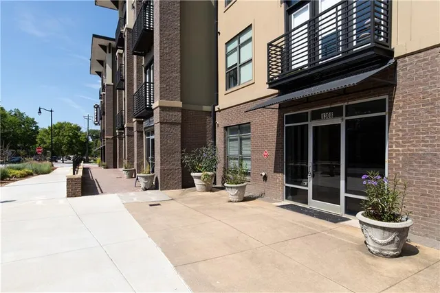 a view of a building with potted plants