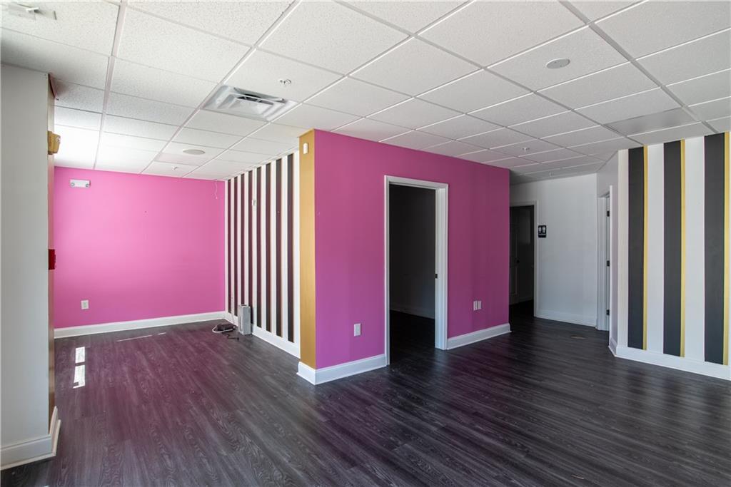 5300 Peachtree Road, Unit 1308 Atlanta, GA 30341 - Photo 4 of 16 a very nice looking room with wooden floor