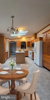 a dining room with a table and chairs