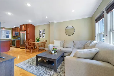 a living room with furniture and a rug