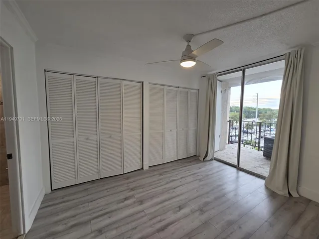 a view of entryway with wooden floor