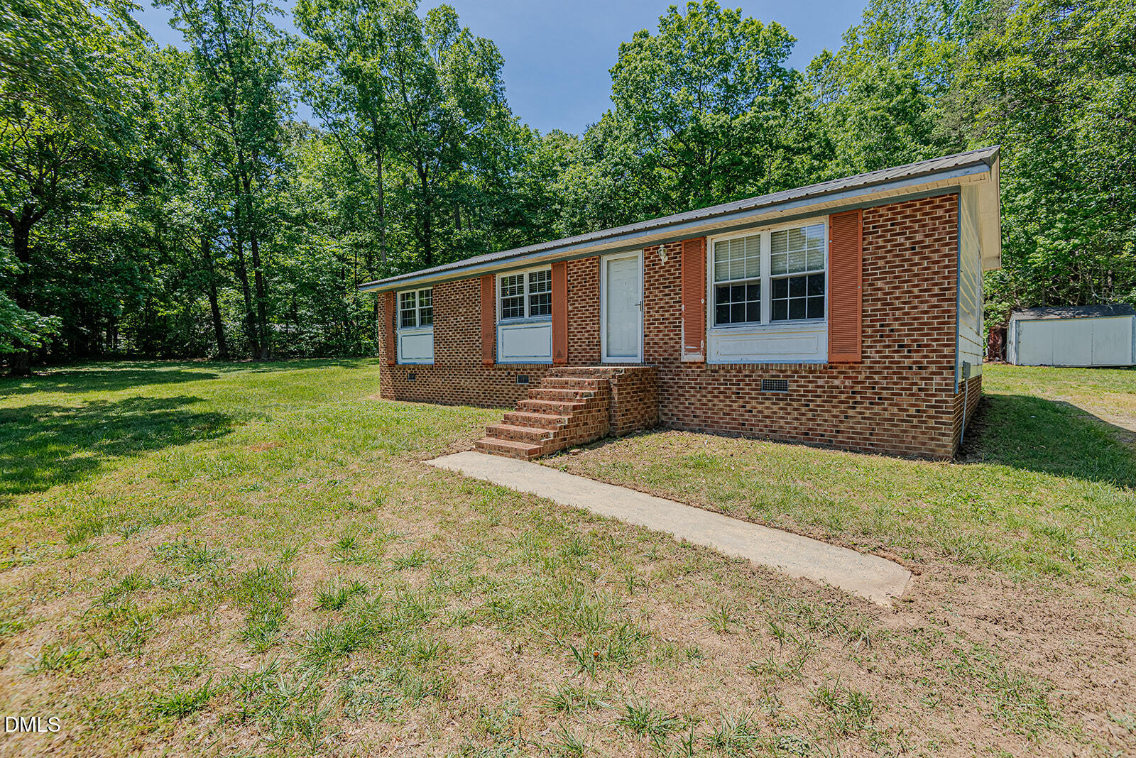 1302 Blacksmith Road Efland, NC 27243 - Photo 30 of 46 a front view of house with yard and trees