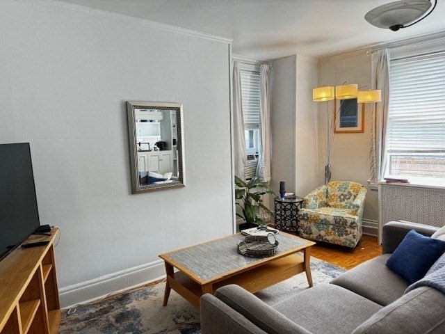 21 Beacon Street, Unit 11A Boston, MA 02108 - Photo 6 of 11 a living room with furniture and wooden floor