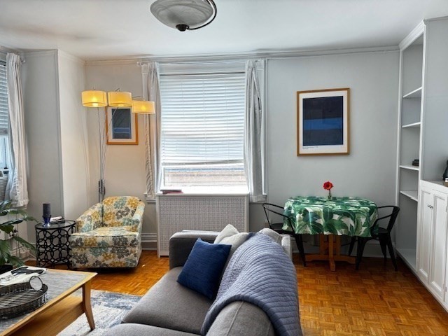 21 Beacon Street, Unit 11A Boston, MA 02108 - Photo 7 of 11 a living room with furniture and a window