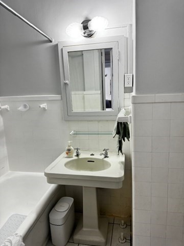 21 Beacon Street, Unit 11A Boston, MA 02108 - Photo 10 of 11 a bathroom with a sink and a mirror